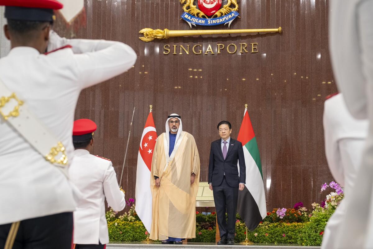 Sheikh Khaled and Lawrence Wong review the guard of honour 